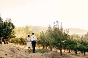 Couple Waling Among Apple Trees